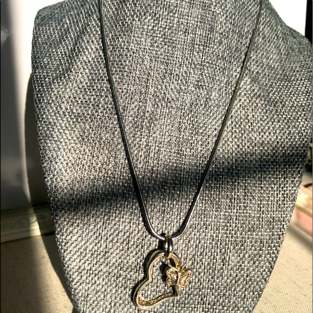 Silvertone heart necklace with butterfly